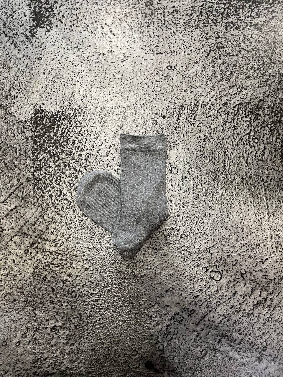 Calze a coste con filato luminoso Nairis