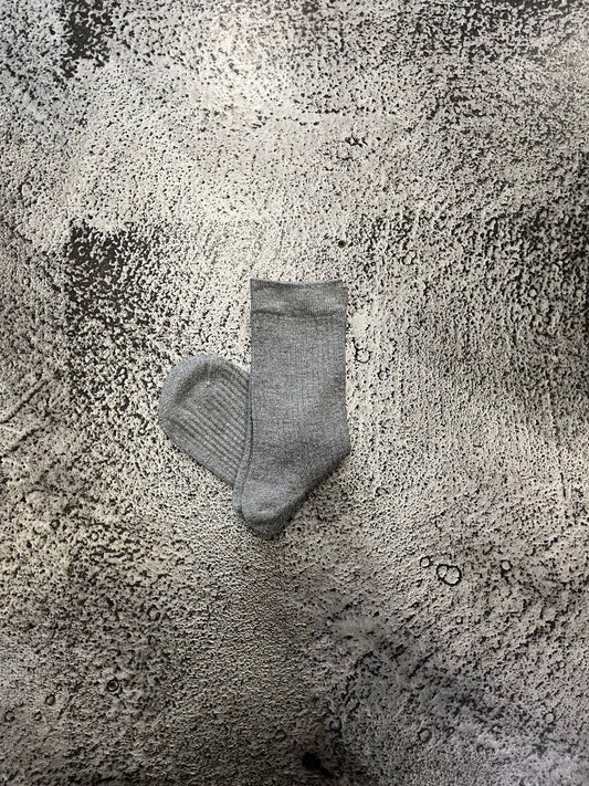 Calze a coste con filato luminoso Nairis