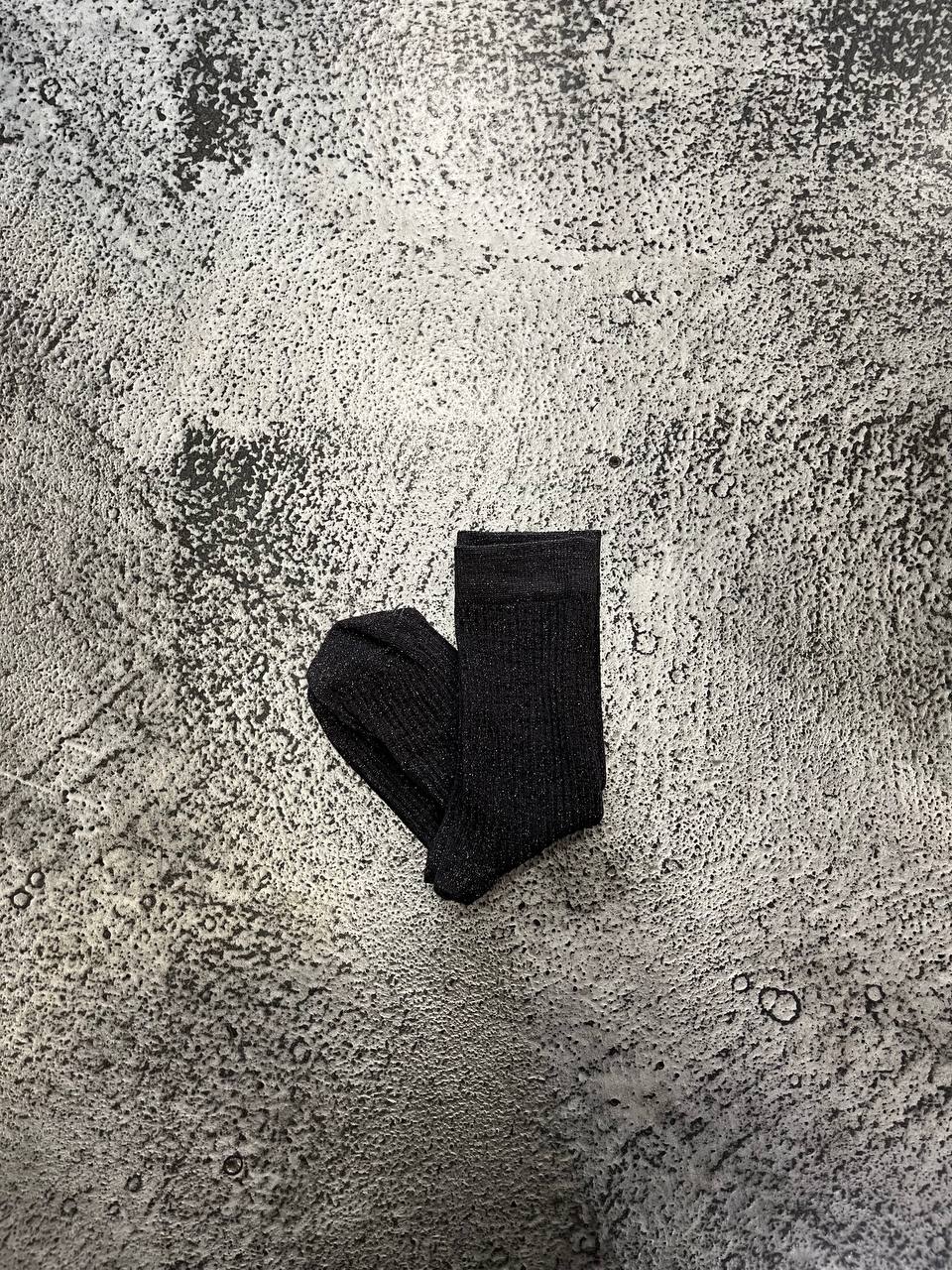 Calze a coste con filato luminoso Nairis